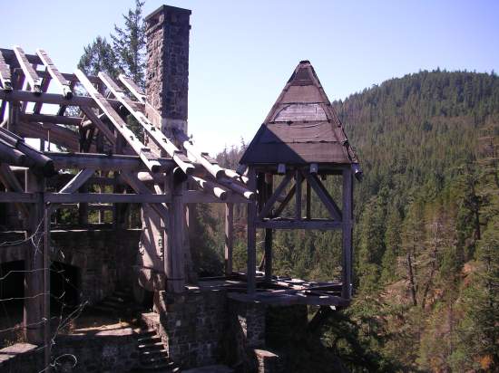 the skeleton of the lodge which stands uncompleted overlooking the Sooke River